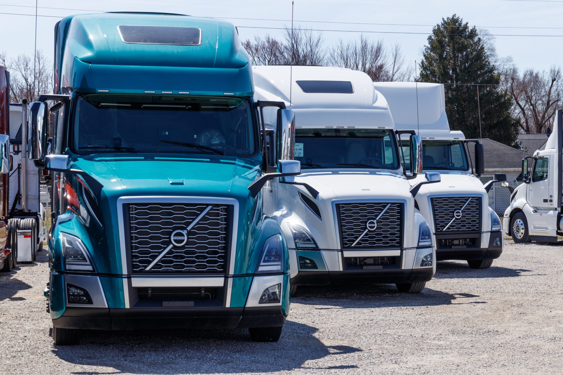 Muncie - Circa March 2019: Colorful Volvo Semi Tractor Trailer Trucks Lined up for Sale. Volvo is one of the largest truck manufacturers IV